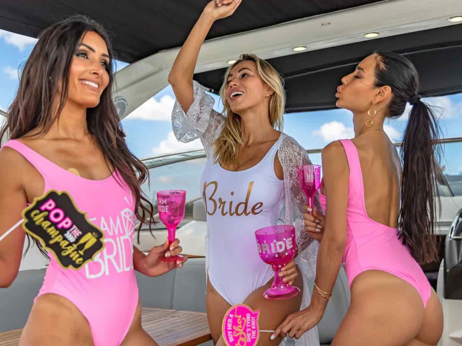 Group enjoying a Cabo bachelorette party boat near The Arch.