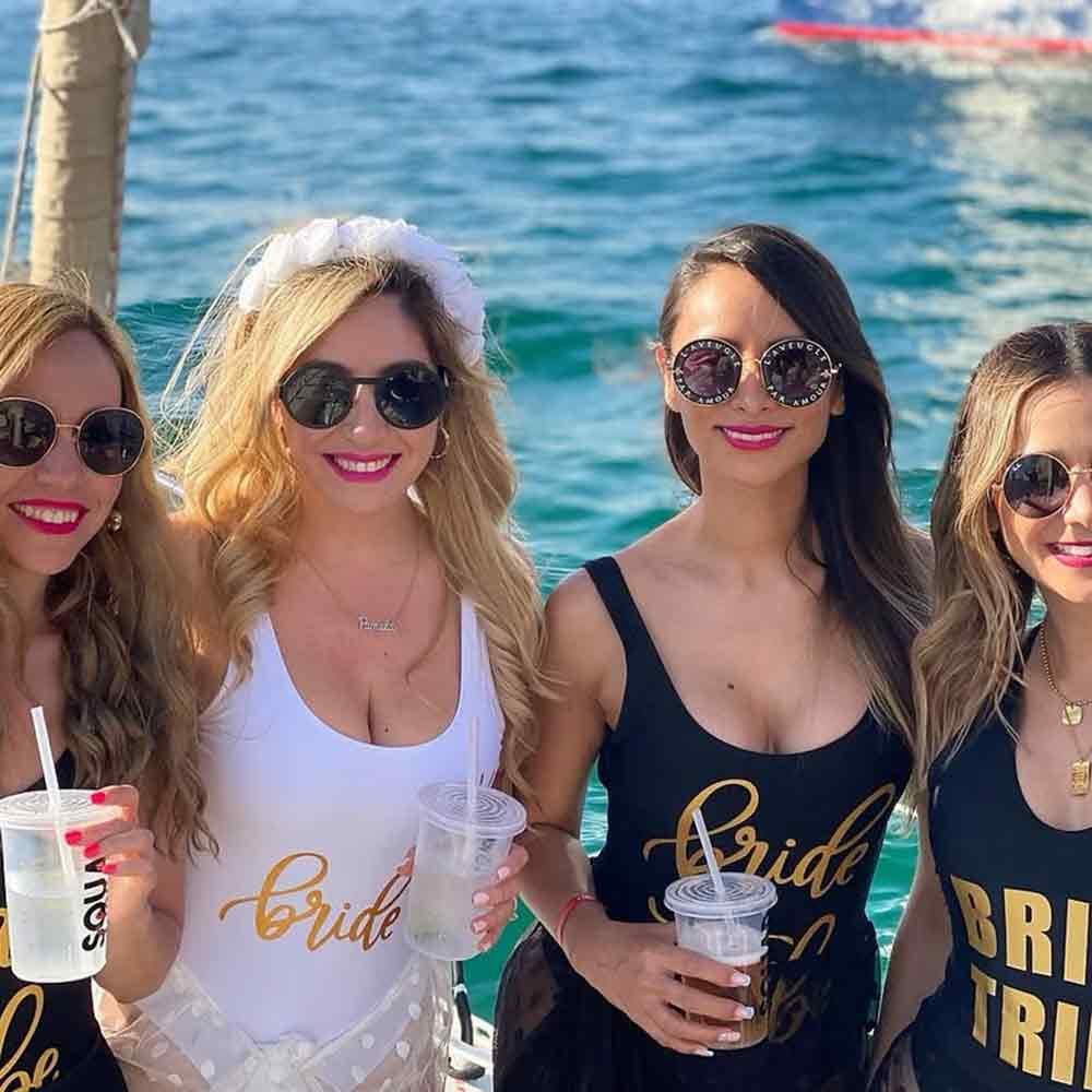 Friends celebrating on a private party boat in Cabo San Lucas.